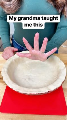 a woman holding her hands out to make a pie crust with the words, my grandma taught me this