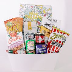 an assortment of snacks in a white basket