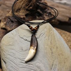 Large Rustic Wolf Tooth Necklace Wolf Teeth Necklace Wolf Necklace Wolf Tooth Necklace Adjustable African Native American Large Wolf Tooth Necklace Simple rustic large wolf tooth necklace made by me with wood & glass beads on a adjustable leather cord I purchase these teeth through a trader that goes around buying them and other things from Tibetan farmers that protect their livestock from the wolves Very nice and simple handmade wolf tooth adjustable necklace on a leather cord. Please view all Teeth Necklace, Large Wolf, Wolf Tooth Necklace, Largest Wolf, Wolf Clothing, Necklace Tattoo, Wolf Tooth, Wolf Teeth, Wolf Necklace