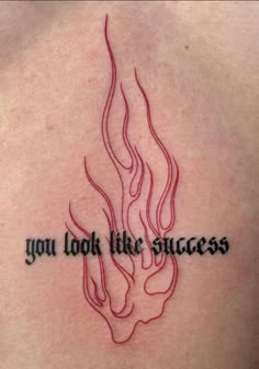 a tattoo with the words you look like success written in black ink on someone's back