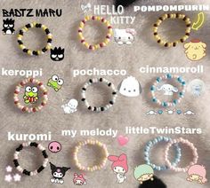 many different bracelets are displayed on a white surface with words written below them that read hello kitty, kawaimi, pochaco, and little twin stars