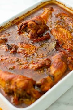 a casserole dish filled with meat and sauce