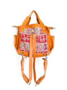 Convertible full grain leather bag with removable straps to wear in three different ways. Includes leather cross body strap and a pair of backpack straps. This mini backpack is made using a traditional huipil from the village of Chichicastenango, Quiché. - 100% foot loomed cotton lining - Artisan made woven huipil- One interior zipper pocket, zipper closure- Hand sanitizer included as in picture- Inside Pockets- Two exterior open pockets - Full camel grain leather - Zipper closure * This bag is Travel Shoulder Bag With Adjustable Strap In Camel, Bohemian Everyday Bag With Strap, Bohemian Crossbody Bag With Strap, Leather Satchel Backpack With Handles, Travel Shoulder Bag With Handles In Camel, Camel Shoulder Bag With Handles For Travel, Bohemian Shoulder Bag With Detachable Strap For Travel, Everyday Bohemian Bag With Strap, Bohemian Crossbody Bag