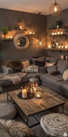 a living room filled with lots of furniture and candles on the wall next to it