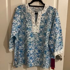 Cathy Daniels Tunic Floral Blouse Size Size L Made In India Colors Blue And White 60 % Rayon 35% Polyester 5% Spandex Exclusive Of Decoration Lace Around The Collar And Cuff. This Items Has No Stains Or Tears. It Is In Excellent Condition. Smoke And Pet Free Home Please See The Pictures For Measurements Bundle With Other Items From My Closet To Get A Good Deal. Items Will Be Shipped On Same Day Depending On Time Of The Purchase Or The Next Day White Floral Print Blouse With 3/4 Sleeves, Blue Tops With 3/4 Sleeves For Vacation, Blue Tunic Blouse For Daywear, Blue 3/4 Sleeve Tops For Beach, Spring Blue Blouse With 3/4 Sleeves, Blue 3/4 Sleeve Tops For The Beach, Blue Tops With 3/4 Sleeve For Beach, Blue Split Neck Blouse, Blue Cotton Half Sleeve Blouse