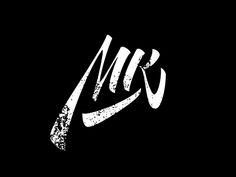 the letter m is written in white ink on a black background