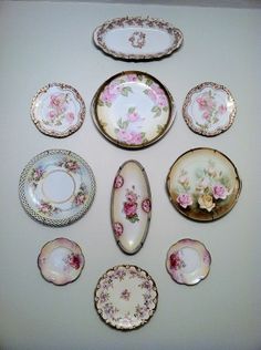 a table topped with lots of different plates and bowls on top of eachother