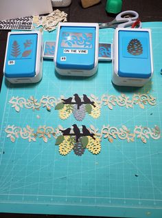 three blue and white boxes sitting on top of a cutting board with pineapples