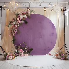 the backdrop is decorated with pink and white flowers