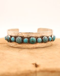 Handmade sterling silver cuff bracelet combines 5 medium and 6 small rounds of turquoise set in a beautiful line pattern Adjustable Hammered Turquoise Jewelry, Richard Schmidt, Felt Cowboy Hats, Straw Cowboy Hat, Concert Fashion, Boot Jewelry, Buckle Bracelet, Coral And Gold, Hammered Sterling Silver