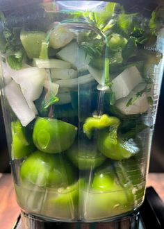 green peppers and onions in a blender with ice cubes