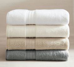 four folded towels stacked on top of each other