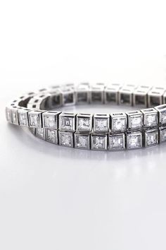 METAL SPECIFICATIONS Metal Name : White Gold 14K STONE SPECIFICATIONS Stone Name : DIAMOND Stone Cut : Princess cut Stone Specifications : There are total diamonds approx. 12 carats. Natural earth mined diamonds. Total Stone Weight : approx. 12.00 carats Color : F/G Clarity : VS2/SI BRACELET SPECIFICATIONS Length : 7" (Can change length, please indicate about change with payment) Appraised Value : $29178.00 Comes with Certificate Luxury Princess Cut Diamond Bracelet For Formal Occasions, Luxury Diamond Bracelet With Asscher Cut, Princess Cut Diamond Bracelet For Wedding, Diamond Baguette Cut Tennis Bracelet, Diamond Tennis Bracelet With 17 Jewels And Baguette Cut, Elegant Princess Cut Tennis Bracelet For Formal Occasions, Luxury Princess Cut Tennis Bracelet For Wedding, White Gold Cubic Zirconia Tennis Bracelet With 17 Jewels, Elegant Princess Cut Diamond Tennis Bracelet