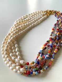 This necklace is made with freshwater pearls rice (4-mm) and Millefiori beads (4-mm) Size chart is provided in the last picture for references! White Necklace With Tiny Oval Beads, Colorful Multi-strand Pearl Beaded Necklaces, Pearl Beaded Necklaces For Jewelry Making With Oval Beads, White Pearl Necklace With Spacer Beads, White Oval Beaded Pearl Necklace, White Pearl Necklace With Oval Beads, White Beaded Pearl Necklace With Oval Beads, Pearl White Pearl Necklace With Colorful Round Beads, Beaded Necklace Diy