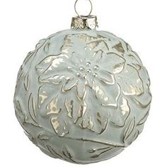 a white ornament hanging from a chain