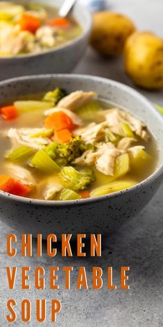 two bowls of chicken vegetable soup on a table