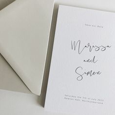 two wedding cards on top of each other with the words, mrs and mr written in cursive ink