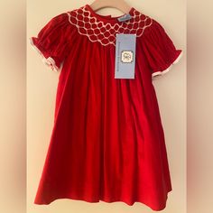 Nwt Red Everyday Heirloom Toddler Dress. It Is Marked As 12 Months, But Runs A Bit Larger. It Is Corduroy With A Smocked Neck And Ruffle Sleeves. Perfect For The Holiday Season! Fitted Red Cotton Smocked Dress, Red Fitted Cotton Smocked Dress, Red Smocked Short Sleeve Dress, Red Smocked Dress With Ruffles And Short Sleeves, Red Cotton Dress With Smocked Back, Red Cotton Smocked Dress, Red Cotton Smocked Dress With Smocked Bodice, Red Cotton Dress With Smocked Bodice, Red Smocked Bodice Dress For Holiday