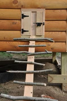 a wooden structure made out of sticks and logs