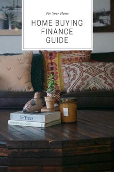 a coffee table with some books on it and a potted plant sitting on top