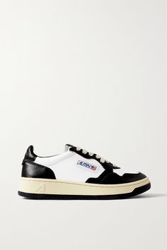 Autry's 'Medalist Low' sneakers are based on vintage styles from the '80s. Set on comfortable rubber soles, they're made from contrasting panels of smooth leather with a perforated toe and a padded ankle collar. The American flag logo at each side is a brand signature. Vintage Custom Leather Sneakers With White Sole, Retro Leather High-top Sneakers, Vintage Leather Sneakers With Gum Sole, Vintage Leather Custom Sneakers With White Sole, Retro Leather Sneakers With Vulcanized Sole, Retro Low-top Sneakers With Leather Sole, Vintage Sneakers With Contrast Sole And Round Toe, Retro Black Leather Sneakers, Vintage Streetwear Sneakers With Leather Sole