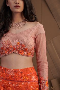 Editor's Note This set features Orange Floral Embroidered Lehenga Set Color: Orange Care: Dry Clean Only About the Designer Shriya Som is engaged in the design, manufacture, and distribution of luxury pret, occasion wear, and bespoke garments specializing in evening wear. The brand is defined to have an understated aesthetic that epitomizes a graceful yet playful look. Floral Embroidered Choli For Eid Reception, Floral Embroidered Choli For Reception Eid, Organza Blouse Piece With Floral Embroidery For Reception, Reception Top With Intricate Embroidery On Georgette, Anarkali Organza Blouse With Floral Embroidery, Traditional Drape Tops For Eid Reception, Semi-stitched Tops For Diwali Reception, Organza Blouse With Intricate Embroidery, Designer Organza Blouse With Floral Embroidery