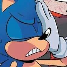 sonic the hedge is eating something out of his mouth