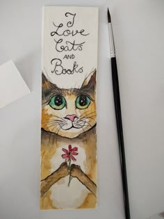 a bookmark with an image of a cat holding a flower and the words i love cats and books written on it