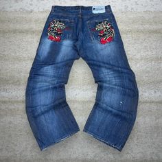 Vintage Skater Wide Leg Jeans Ed Hardy Dark Wash Baggy Denim Embroidered Rap Style Art Y2K Skate / Streetwear Condition: 7/10 (small marks like shown, aka some character) Men's Size:  Waist: 34" Length (inseam): 32" (inseam shortened) Leg Opening: 9.5" Thigh Opening: 13" Front Rise: 12" Art Y2k, Skate Streetwear, Skater Jeans, Vintage Skater, Baggy Denim, Skater Streetwear, Y2k Skater, Ed Hardy, Baggy Jeans