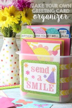 some cards and vases with flowers in them on a table that says make your own greeting card organizer