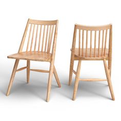 two wooden chairs sitting next to each other