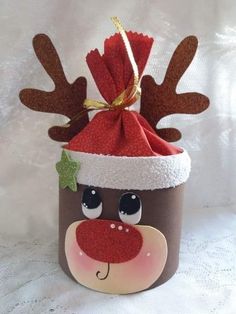 a brown cup with a reindeer hat on it