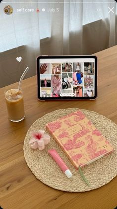 a wooden table topped with a tablet computer next to a cup of coffee