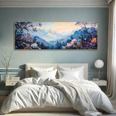 a large painting on the wall above a bed in a bedroom with white linens