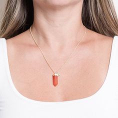 The Carnelian Crystal Point Necklace is the best way to bring power and courage to your day. In shades of sterling silver or gold, this radiant sunset stone knows how to bring rich energy, ignite your vibrancy, and keep you motivated in the pure magic of accomplishment.  “With this necklace, there is space for my warrior spirit and inner child.” Description The Carnelian Crystal Point Necklace is a tour du force. Dressed in warm shades of orange and red, the Carnelian Stone is potent and powerful. This vivacious gem can do it all - from stimulating your metabolism to stirring up your libido, addressing fertility, and finetuning your confidence - it works across body, mind, and soul. Wearing the Carnelian Crystal Point is all about balance and action - it keeps you moving and shaking but en Rich Energy, Channeling Energy, Crystal Point Necklace, Carnelian Crystal, Warrior Spirit, Carnelian Stone, Inner Child, Shades Of Orange, Crystal Points