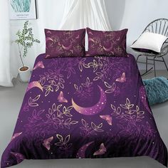 a bed with purple comforter and matching pillows