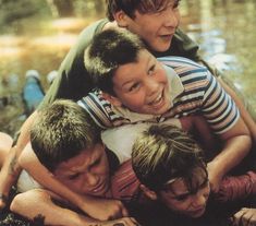 a group of young boys hugging each other