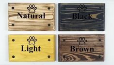 four wooden signs with different types of dog paw prints and the words natural, light, brown