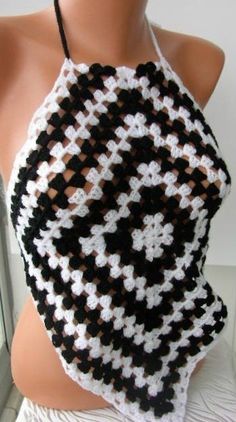 a black and white crocheted halter top on a mannequin head