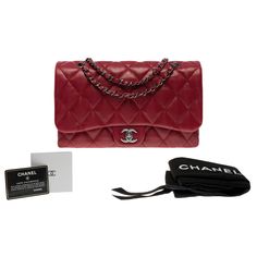 Gorgeous Chanel Classic shoulder flap bag with bellows in garnet red quilted lambskin leather, silver metal hardware, a silver metal chain handle intertwined with red leather for shoulder and crossbody carry Closure by flap, silver CC logo clasp Single Flap Inner lining in red fabric, 1 zipped pocket, 1 patch pocket, 3 compartments Signature: "Chanel®Made in Italy" Date: 2011 Dimensions: 29x17x8 cm (11,5x6,7x3 Inches) Chain length: 53 cm (21 Inches) Reference: 101255 Packaging: Hologram: Yes Car Garnet Red, Red Quilts, Bellows, Leather Silver, Cc Logo, Red Fabric, Red Garnet, Metal Hardware, Flap Bag