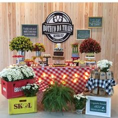 a table topped with lots of different types of food and flowers on top of it