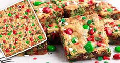 christmas cookie bars with candy and sprinkles on paper next to a glass of milk