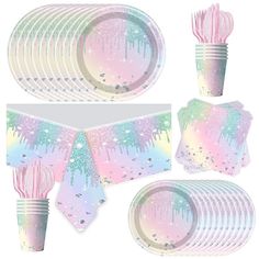 a table setting with pink and blue paper plates, napkins, cups and utensils