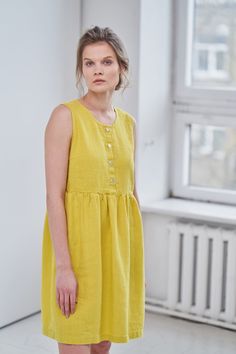 "MsWrinkle's clothing - from human to human. 100% handmade. *Description* - Sleeveless smock/maternity dress with pockets. Breastfeeding friendly ; - High quality European linen; - Washed and softened (doesn't shrink anymore); - Medium weight linen (150 g/m2); - Our linen is OEKO-TEX certified that meets human ecological safety requirements; - Model is wearing size S in lemon yellow, snow white, sky blue and elephant grey color (other sizes and colors please choose on the right) - Light colors l A-line Linen Dress With Buttons, Linen Maternity Dress, Womens Summer Dress, Linen Maternity, Long Linen Shirt, Linen Slip Dress, Sleeveless Linen Dress, Linen Shirts Women, Loose Fit Blouse