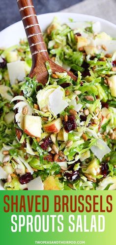 shaved brussels sprouts salad with apples and cranberries in a white bowl