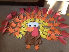 a turkey made out of paper on the floor