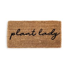 a door mat that says plant lady on it with the word plant lady written in black ink