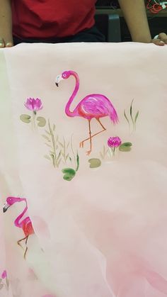 a pink flamingo painting on a white sheet