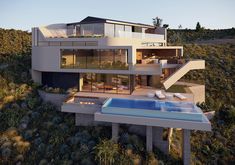 an aerial view of a house with a swimming pool in the foreground and stairs leading up to it