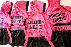 three pink and black boxing gloves with the words brooklyn's millie printed on them